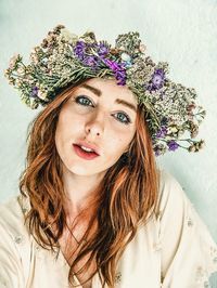 Portrait of beautiful young woman wearing flowers