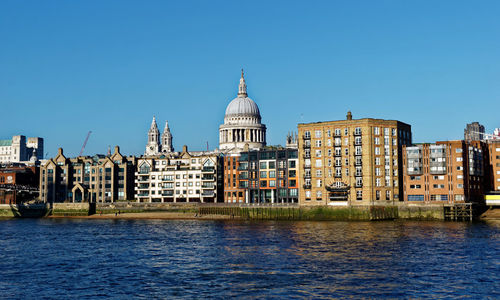 View of buildings against blue sky