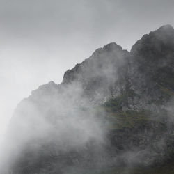 Scenic view of mountains in foggy weather