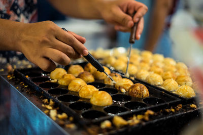 Cropped hands preparing food