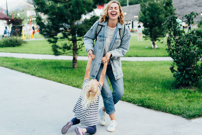 Full length of happy woman in park