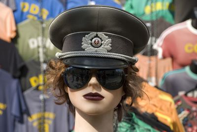 Portrait of young woman wearing sunglasses at store