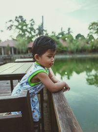 Cute boy looking at lake