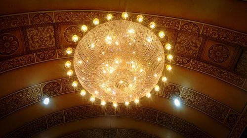 Low angle view of illuminated chandelier