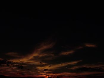 Low angle view of dramatic sky at night