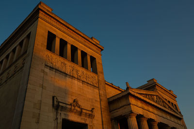 Low angle view of building against clear blue sky