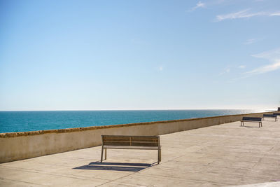 Scenic view of swimming pool by sea against sky