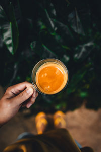 Cropped hand holding coffee