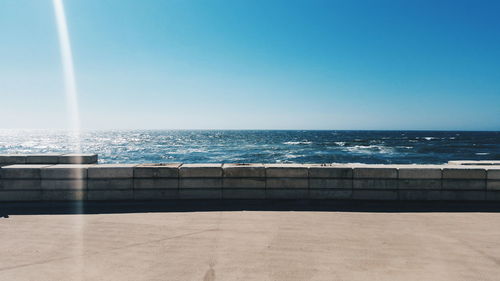 Scenic view of sea against clear sky seen from promenade