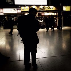 Woman in city at night