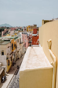 High angle view of road amidst buildings against sky