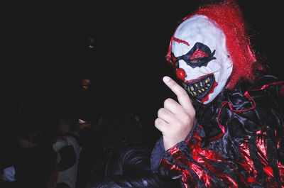 Man wearing halloween costume on street at night