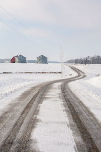 Empty road against sky