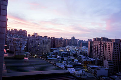 High angle view of buildings against sky during sunset