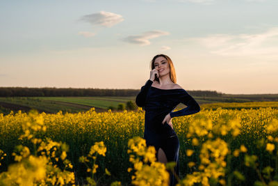 Full length of woman standing on field