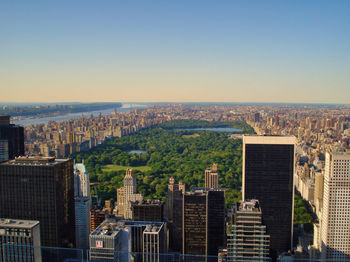 High angle view of buildings in city against clear sky