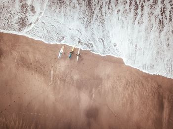 High angle view of people on sea shore