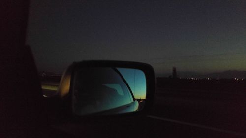 View of trees against sky at dusk