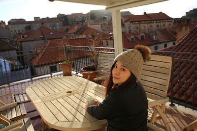 Woman standing against buildings