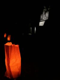 Close-up of illuminated pumpkin against black background