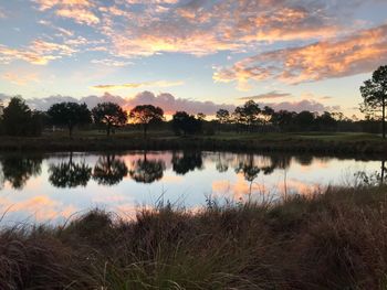 Scenic view of lake against sky during sunset