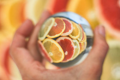 Close-up of hand holding fruit