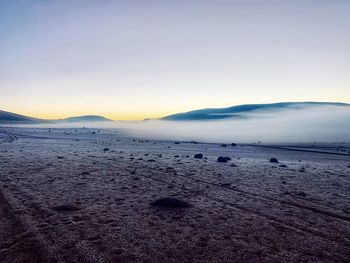 Scenic view of landscape against sky during sunset