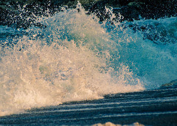 Close-up of waves splashing water