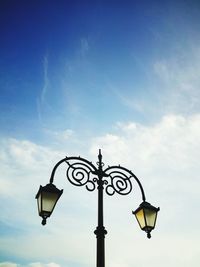 Low angle view of street light against sky