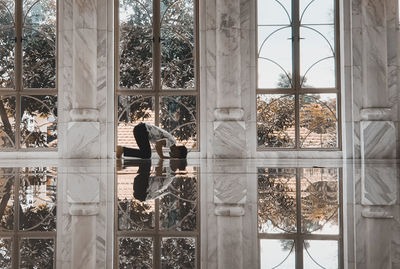 A muslim man praying in the mosque alone and making a reflection