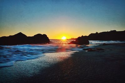 Scenic view of sea at sunset