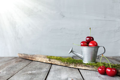 Close-up of red cherries on table