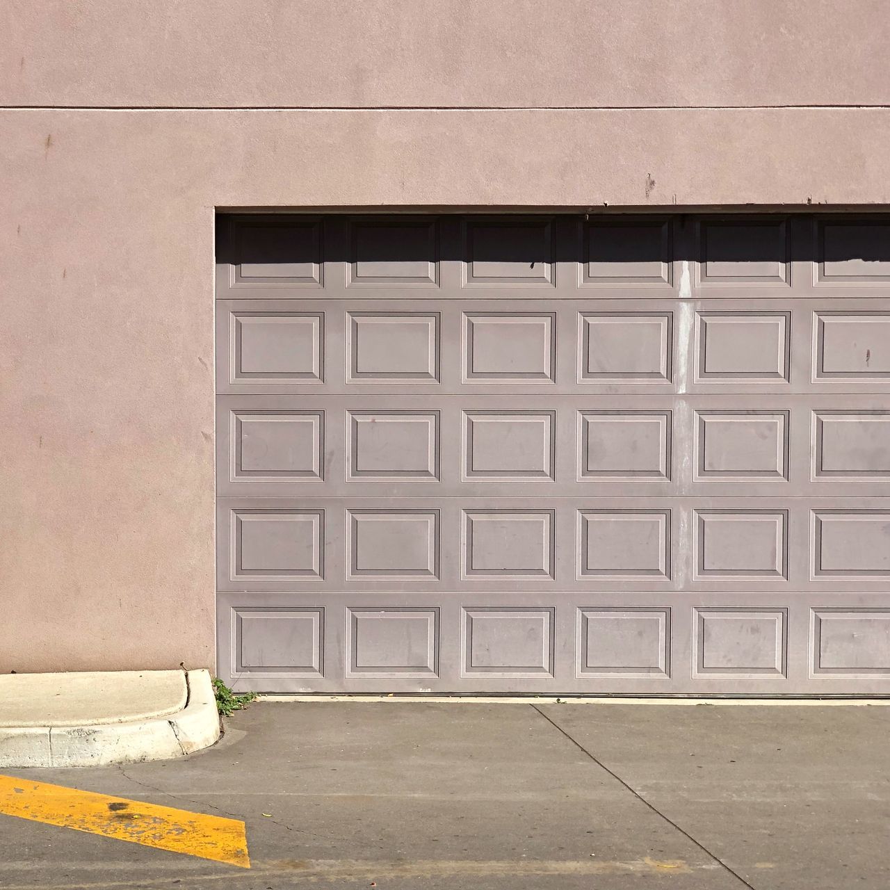 built structure, architecture, building exterior, no people, wall - building feature, day, entrance, door, footpath, closed, building, outdoors, white color, wall, pattern, window, city, flooring, sunlight, security, garage