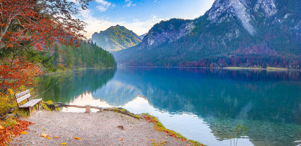 Scenic view of lake and mountains against sky