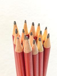 Close-up of colored pencils against white background