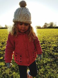 Girl smiling in park against sky