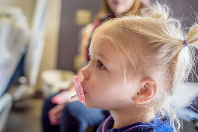 Close-up of girl with pacifier