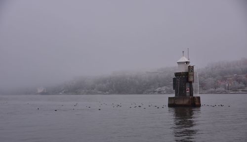 Scenic view of sea against sky during foggy weather