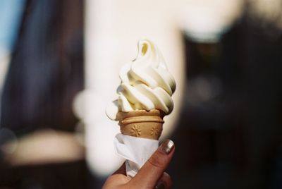 Hand holding ice cream cone