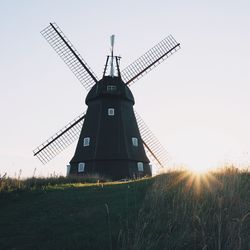 Traditional windmill against clear sky