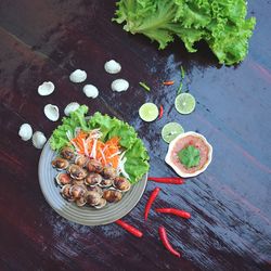 High angle view of chopped vegetables in bowl on table