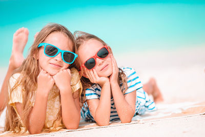 Portrait of a girl wearing sunglasses on beach