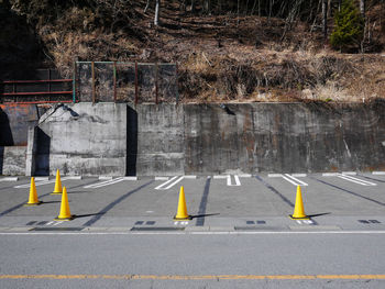 Yellow traffic cones on parking lot