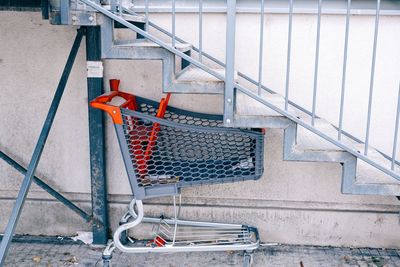 Shopping trolley under the stairs 