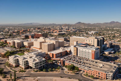 High angle view of buildings against clear sky