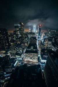 High angle view of illuminated city buildings at night