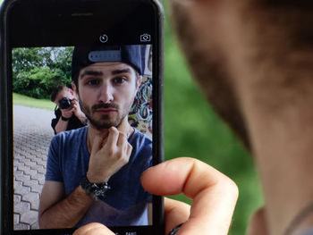 Woman photographing through smart phone