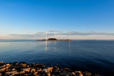 Scenic view of sea against sky at sunset