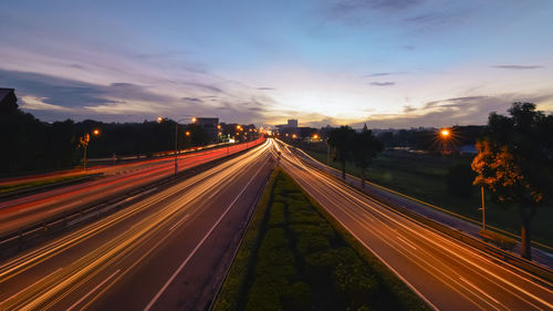 High angle view of light trails on road at night