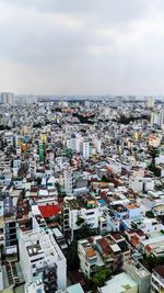 Aerial view of cityscape against sky